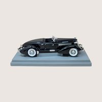 Vintage black ERTL American Muscle 1935 Auburn 851 Speedster diecast model in original worn display box.