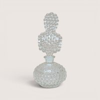 Vintage clear glass perfume bottle with a textured bubble pattern and unique bubble-shaped stopper.