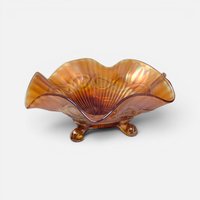 Antique 1910s Northwood marigold carnival glass footed bowl with wide ruffled rim and iridescent finish.