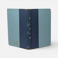 Vintage 1962 hardcover book A Woman's Place by Ann Helming in blue cloth on a plain background.