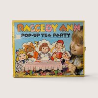 1974 vintage Raggedy Ann Pop-Up Tea Party Colorforms box featuring colorful character illustrations of Raggedy Ann and friends.