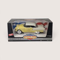 Vintage 1995 Ertl American Muscle yellow and white 1955 Chevrolet Bel Air die-cast vehicle in its original window box set against a plain linen background.