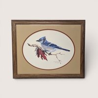 Framed vintage blue jay art print signed by Beck Krueger featuring a blue bird on a branch with a red leaf