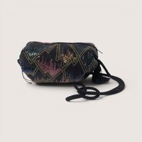 Vintage black evening purse covered in sparkling multicolor seed beads with a black cord strap