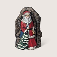 Vintage 1990s ceramic Old World Santa with tree trunk vase.