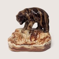 Vintage Alaskan marbled clay ashtray with an integrated brown bear figurine.