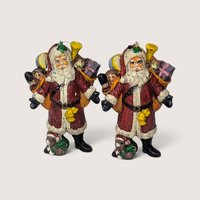 Set of 2 vintage blowmold style plastic Santa Claus Christmas ornaments with paint loss.