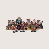 Set of 7 vintage plastic Santa Claus Christmas ornaments and one freestanding figurine.