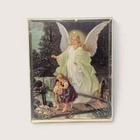 Vintage dimensional religious print featuring a guardian angel guiding children across a bridge, preserved in original protective plastic.