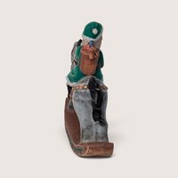 Vintage Green Santa on Rocking Horse Ceramic Figurine