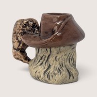 Vintage hand-painted ceramic character mug depicting Buffalo Bill Cody with a sculpted bison handle and "DAD" inscribed on the base.