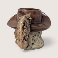 Vintage hand-painted ceramic character mug depicting Buffalo Bill Cody with a sculpted bison handle and "DAD" inscribed on the base.