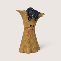 Vintage hand-painted ceramic figurine of a whimsical smiling corn stalk with a black cat resting on top.