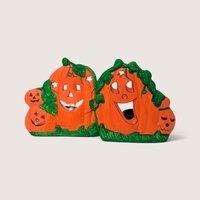 Vintage K's Collection ceramic Halloween jack-o'-lantern candle holder pair with carved pumpkin faces.