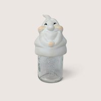 Vintage ceramic ghost mason jar topper with painted rosy cheeks sitting on a clear Hershey glass jar.