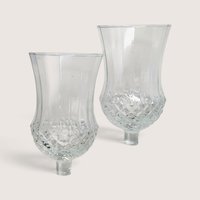 Pair of vintage clear glass peg votive candle holders with textured diamond cut lower bowls.