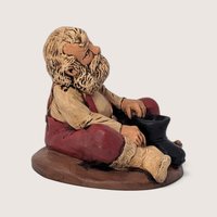 Vintage Santa Putting On Boots Resin Christmas Figurine