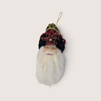 Vintage Santa head Christmas tree ornament with an ornate velvet hat and a red flower detail.
