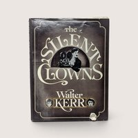 Vintage 1975 hardcover book titled The Silent Clowns by Walter Kerr with its dust jacket featuring a vintage photograph of Charlie Chaplin.