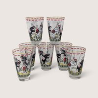 Vintage set of clear glass circus tumblers featuring performing elephants, circus acts, and gold rims.