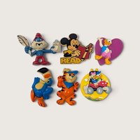 A set of six vintage molded character refrigerator magnets