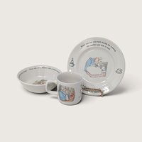 A vintage Wedgwood Peter Rabbit 3-piece child's dinner set including a decorated plate, a cereal bowl, and a mug featuring classic Beatrix Potter illustrations against a neutral background.
