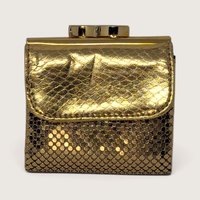 Vintage Whiting and Davis gold metal mesh compact bifold wallet with metallic snakeskin flap and top clasp on a light backdrop.   