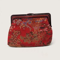 Vintage red woven silk brocade clutch purse featuring an Asian landscape motif with amber acrylic kiss lock frame on white backdrop.   