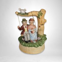 Artmark Ceramic Swinging Older Couple Music Box - Sentimental Melodies of Togetherness