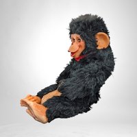 Charming Toy: Vintage Rubber Face Monkey Doll with a Touch of Creepy Nostalgia