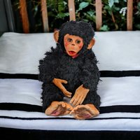 Charming Toy: Vintage Rubber Face Monkey Doll with a Touch of Creepy Nostalgia