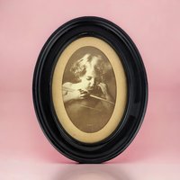 Vintage Cupid Asleep Framed Print by M.B. Parkinson - Romantic Wall Decor - Cherub Art - Oval Frame