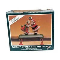 Vintage Kissing Santa Stocking Holder: Cast Iron Christmas Mantle Hanger