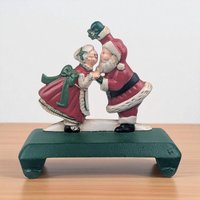 Vintage Kissing Santa Stocking Holder: Cast Iron Christmas Mantle Hanger
