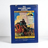 Vintage 1922 Montgomery Ward Golden Jubilee reproduction catalogue with a deep blue cover featuring a central colorful stagecoach illustration and white typography.