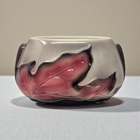 A rectangular ceramic planter with a sculptural raised leaf design. The body is finished in a warm beige speckled glaze, while the relief leaves are accented with a soft, airbrushed pinkish-red hue that creates a gentle gradient effect.