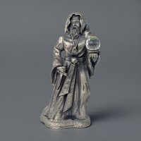 A tall pewter sorcerer figure wearing a long hooded robe and holding a staff. A large translucent crystal orb is embedded in the base. The metal has a dark antiqued finish with a vertical, powerful silhouette.
