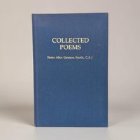 A medium blue cloth-bound hardcover book with a fine vertical grain texture. The title and author name are stamped in a crisp, metallic gold serif font on the front cover. The silhouette is rectangular with sharp, well-preserved corners.
