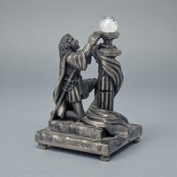 A solid pewter figurine featuring a medieval knight in full plate armor, standing and holding a chalice with both hands. The knight has a detailed surcoat and helmet, with the entire sculpture finished in a soft matte grey antiqued patina.