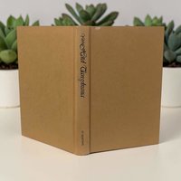 A vintage hardcover book with a tan cloth binding and dark blue text on the spine. The title page displays "Hotel Transylvania a novel of forbidden love" in a stylized serif font above the author's name.