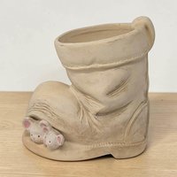 Small ceramic planter shaped like a weathered brown work boot. Two white mice with pink ears are perched on the toe and rim. Toffee-colored glaze with dark brown antiquing in the crevices and faux-stitching details.