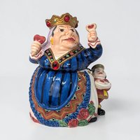 A colorful ceramic cookie jar shaped like the Queen of Hearts from Alice in Wonderland. She wears a blue striped gown and a gold crown, holding a heart-shaped tart. A small page boy stands behind her skirt.
