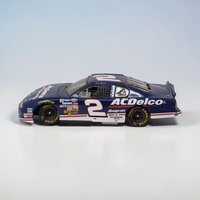 A 1:24 scale die-cast race car with a deep blue body and white and red "ACDelco" branding. The hood features the number "2" and "ACDelco" logo, with various contingency sponsor decals across the front fenders. The car has black wheels and a detailed black interior.