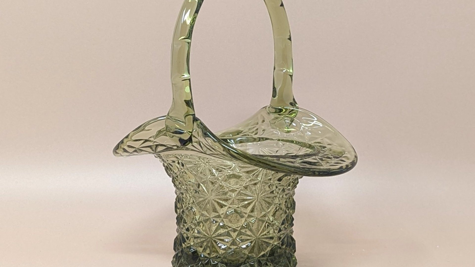 Fenton Colonial Olive Green Daisy and Button Top Hat Basket. Mid 20th Century. Green art glass. Measures 7 1/2" in height by about 5 1/2" wide. Excellent condition. 