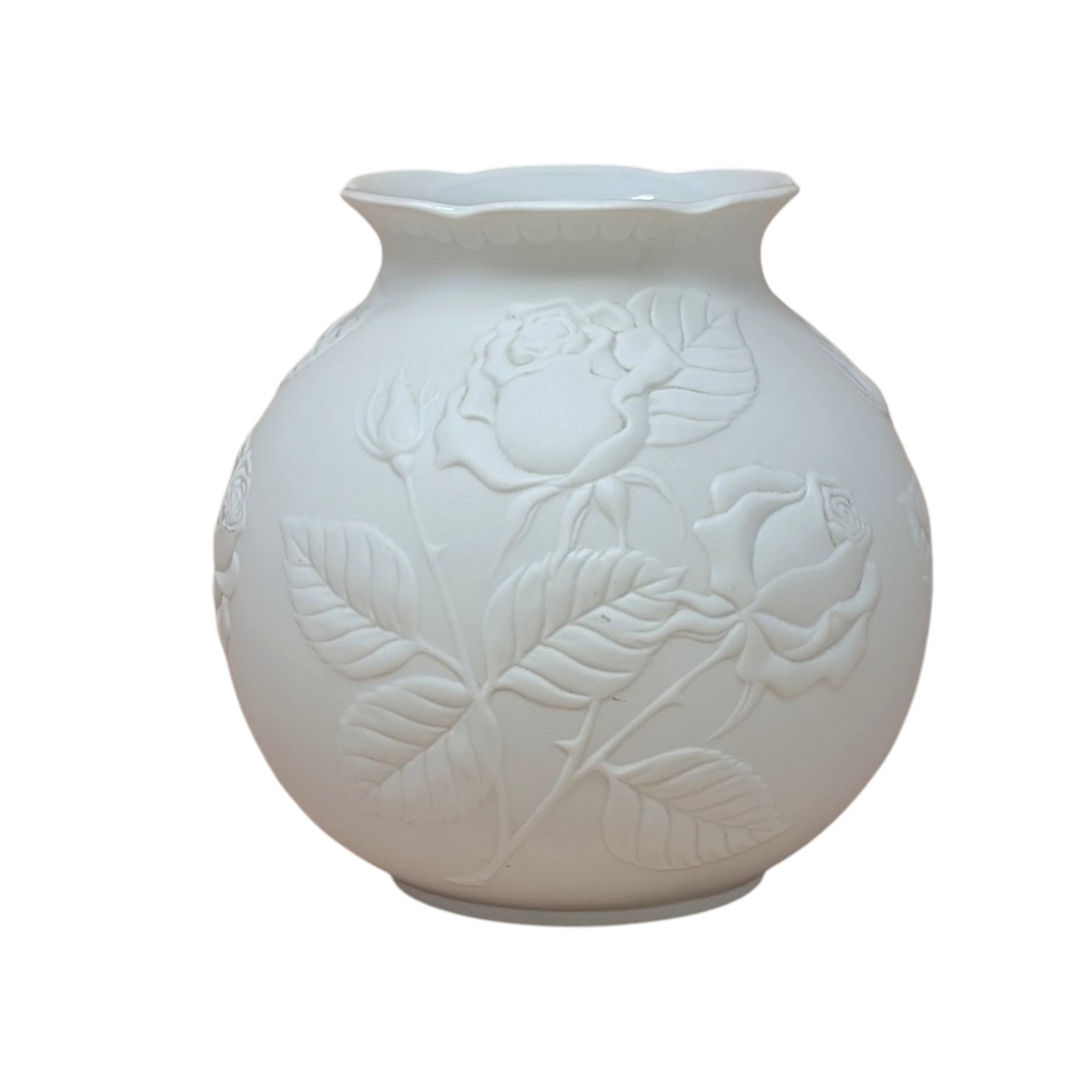 Kaiser West Germany white bisque porcelain vase with a globular body and flared rim. Features a high-relief embossed rose and leaf design with a soft matte finish. 5.5 inches tall.