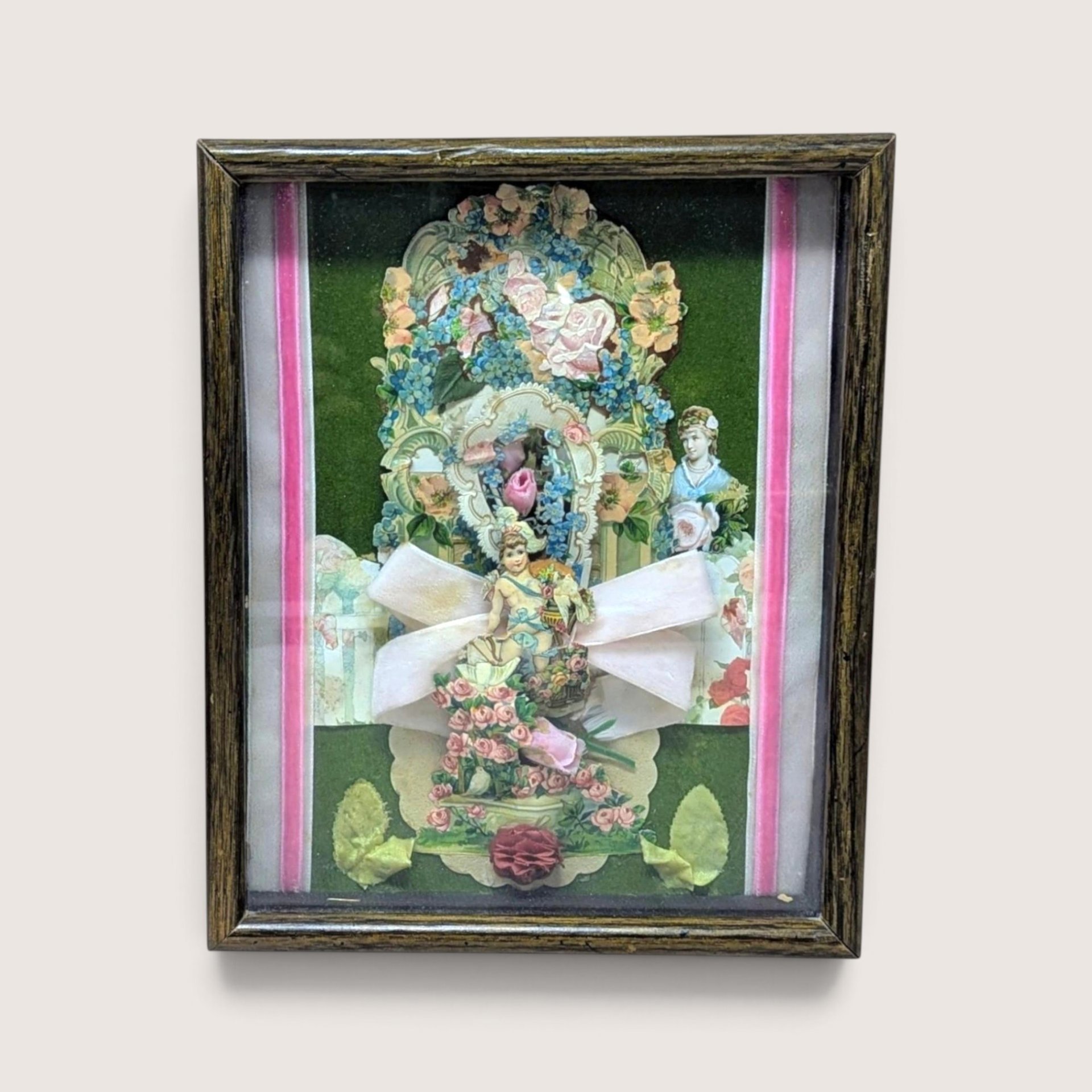 Framed antique Victorian Valentine paper collage shadow box with layered floral motifs and ribbon.