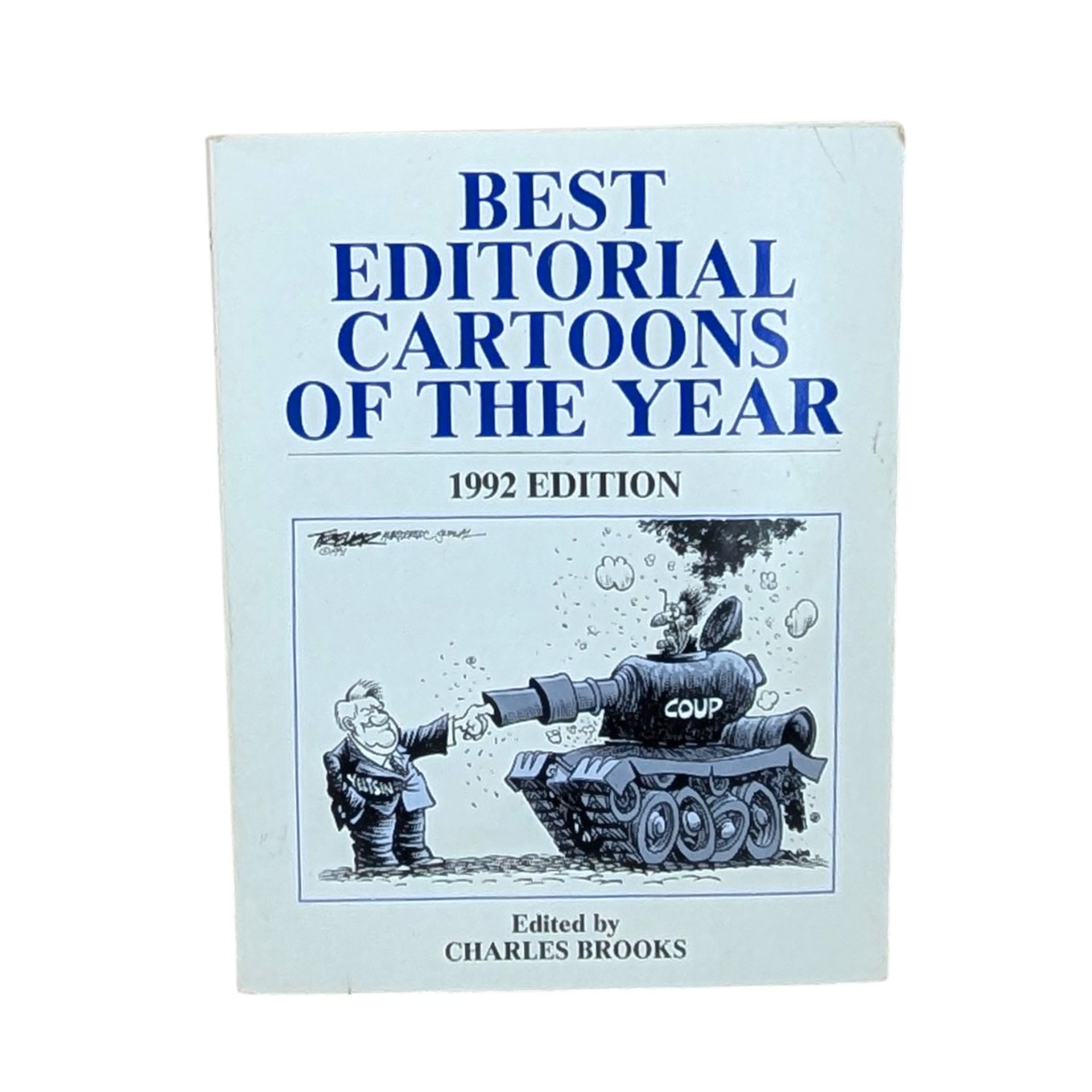 A vertical book titled "Best Editorial Cartoons of the Year 1992 Edition." The cover features a satirical illustration of Yeltsin shaking hands with a tank. Large blue serif text on a cream background.