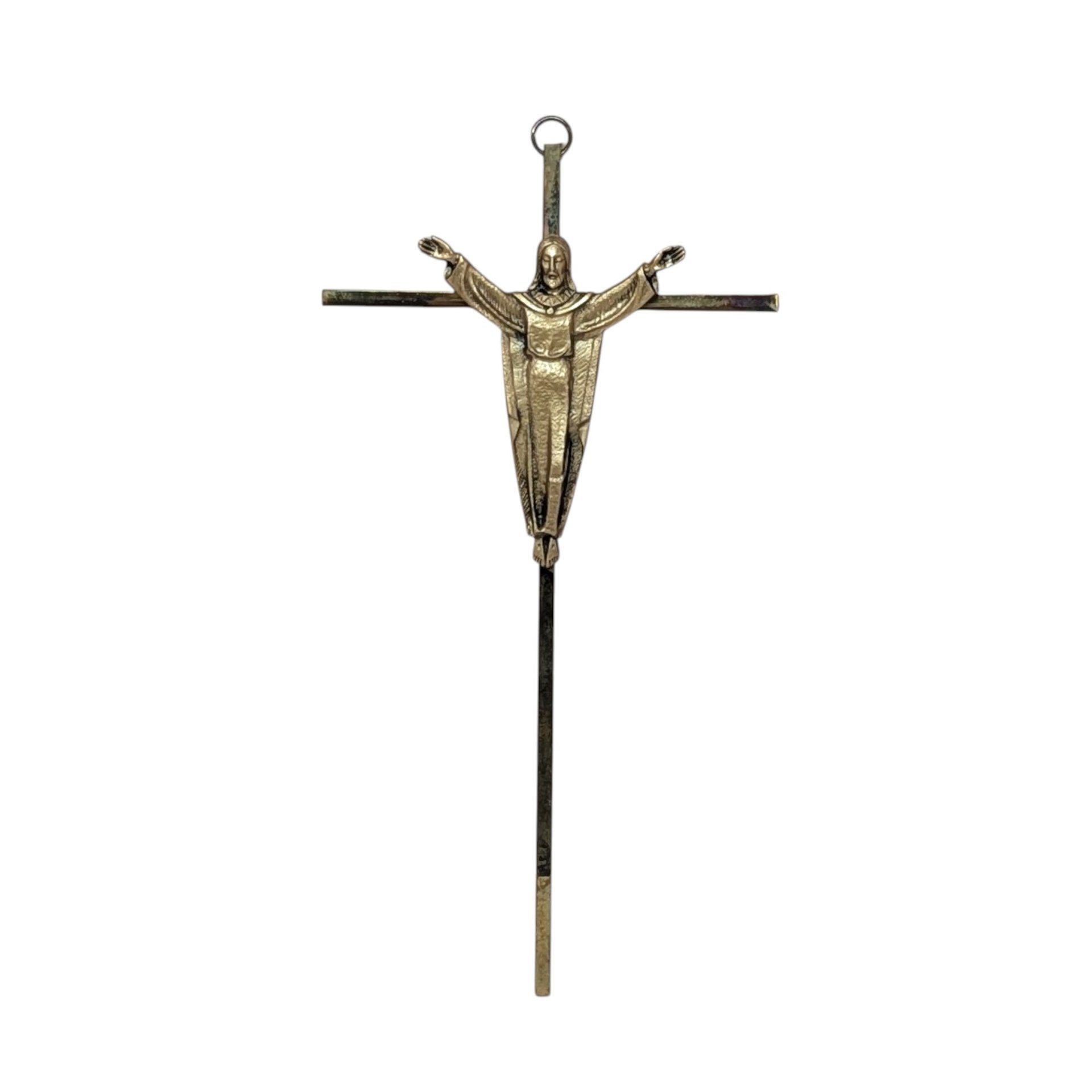 A vertical 10-inch brass crucifix wall hanging. Features a slender, modernist cross with a sculptural figure of the Risen Christ with arms outstretched. Aged brass finish with authentic patina.