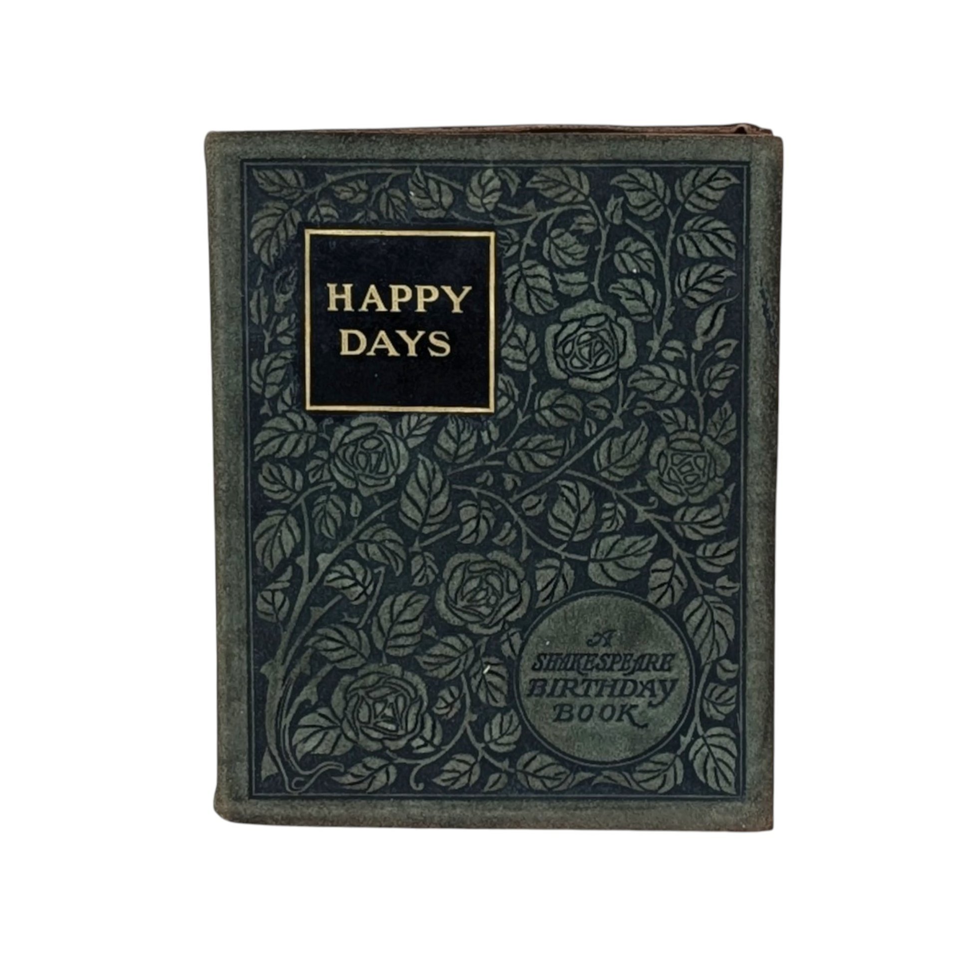 A small, 1904 leather-bound book titled "Happy Days: A Shakespeare Birthday Book." The dark cover is intricately embossed with a floral rose pattern and gold-foil lettering, showing a soft, aged patina on the edges.