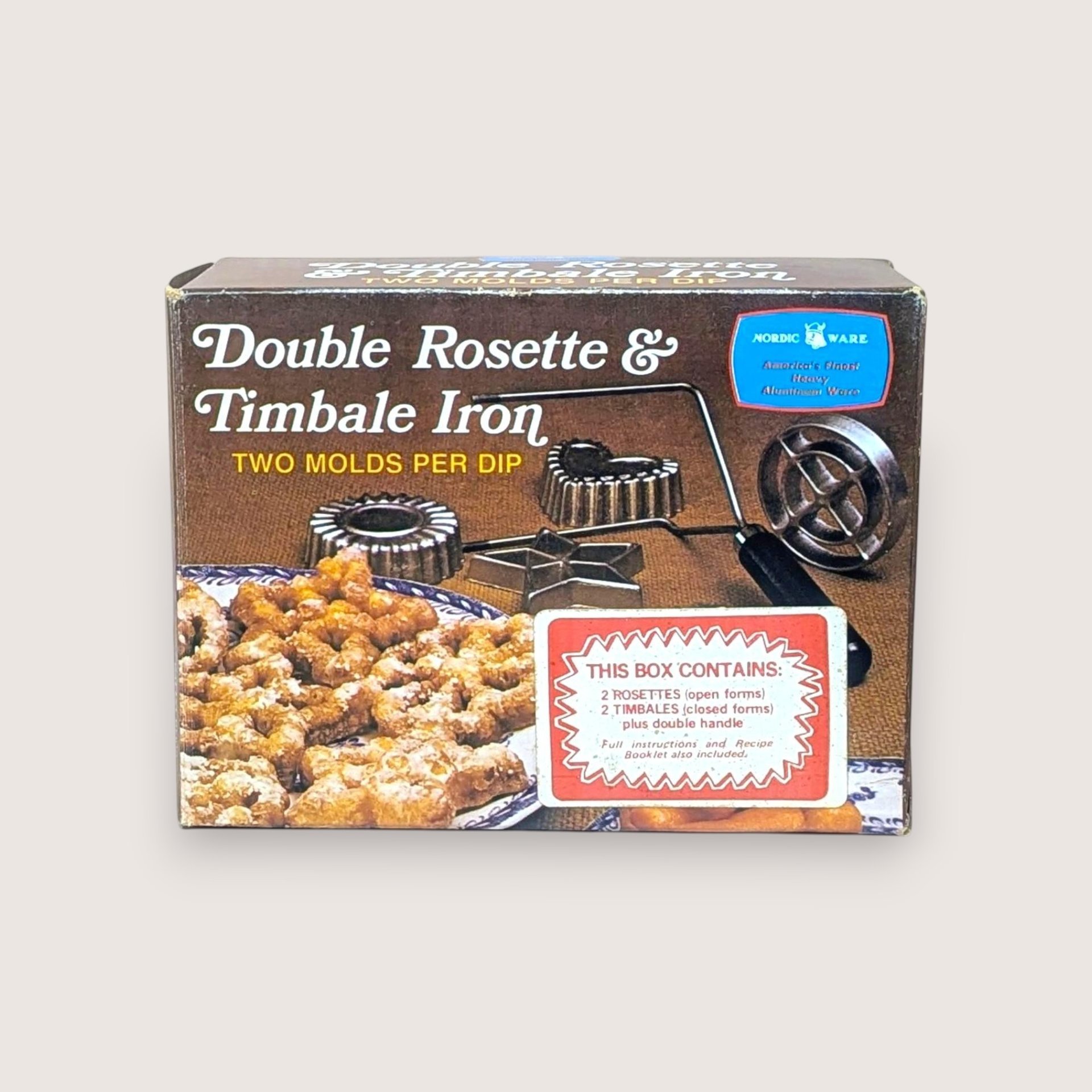 Vintage Nordic Ware Double Rosette and Timbale Iron box showing the product and pastries, isolated on a light background.